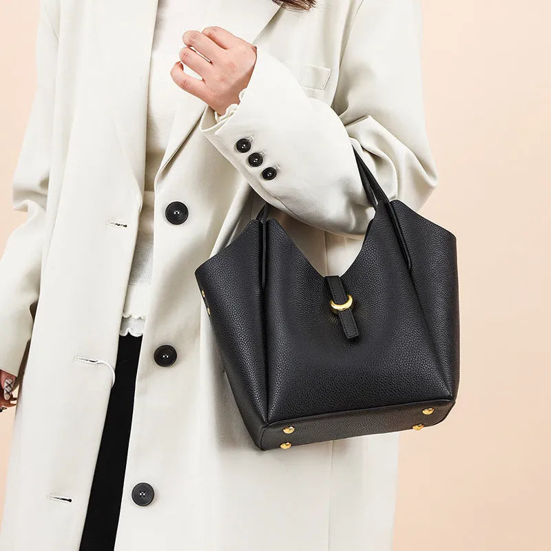Genuine leather women's large capacity hand holding bucket bag in retro style.