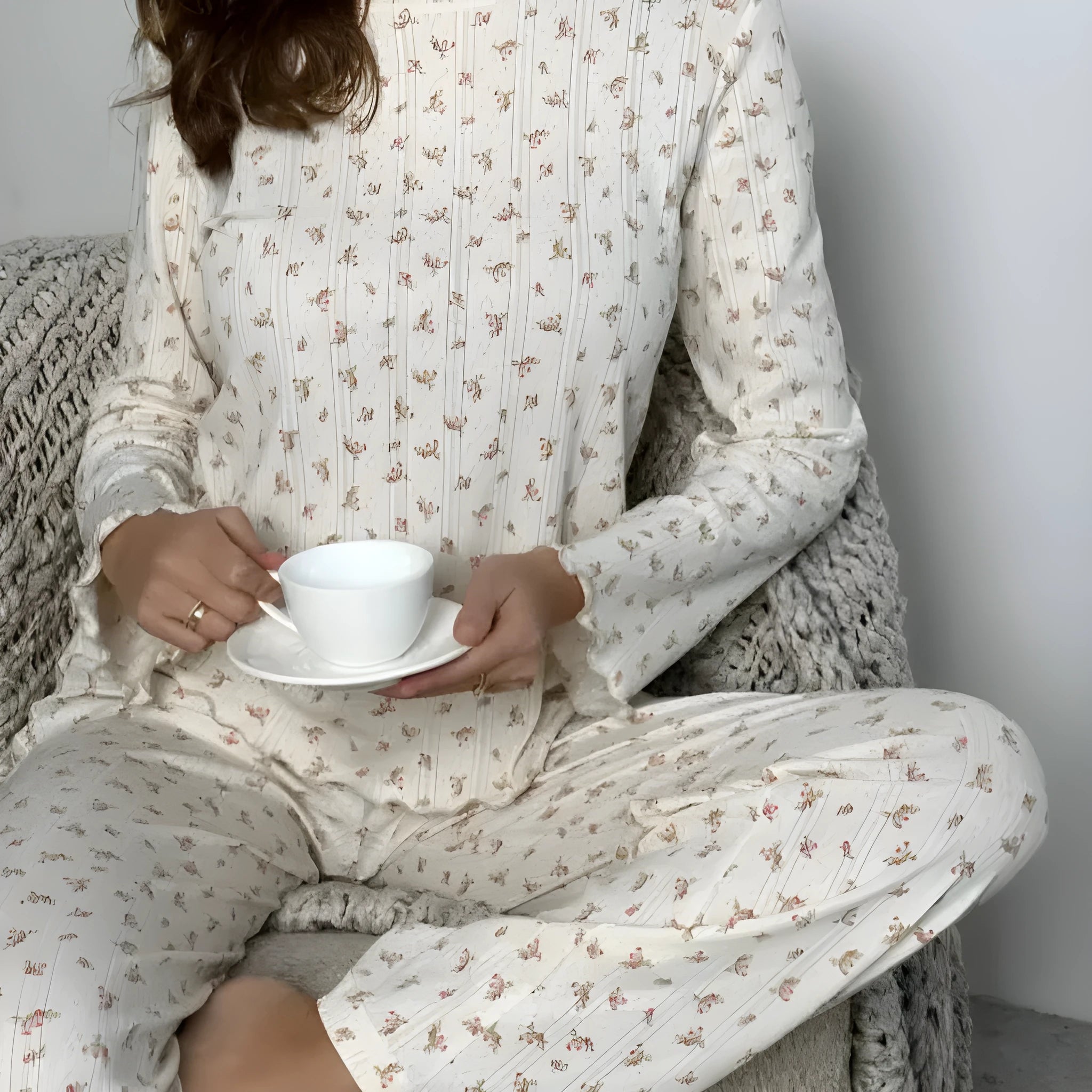 White floral print women's two-piece lounge suit with bell sleeves and wide-leg trousers