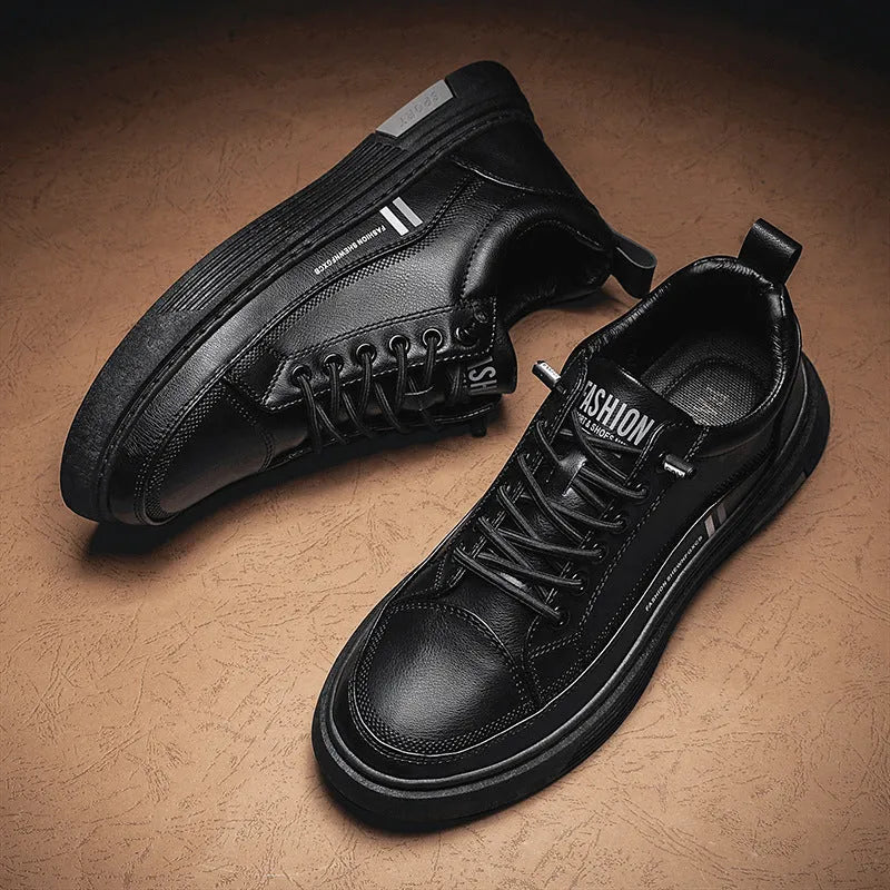 Men's low-top skate shoes with elastic band, microfiber upper, and round toe in black and white.