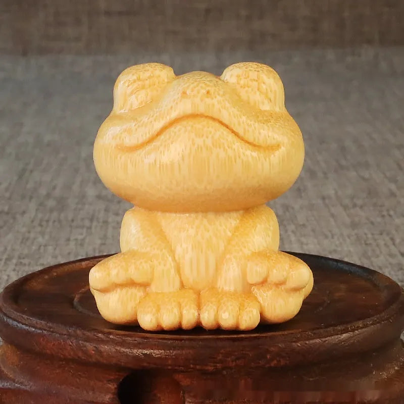 Solid bamboo smiling frog carving ornament measuring 5cm height with cartoon style design