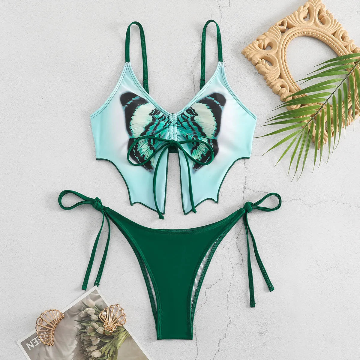 Women's purple bow ins style split bikini set with briefs, on a mannequin.