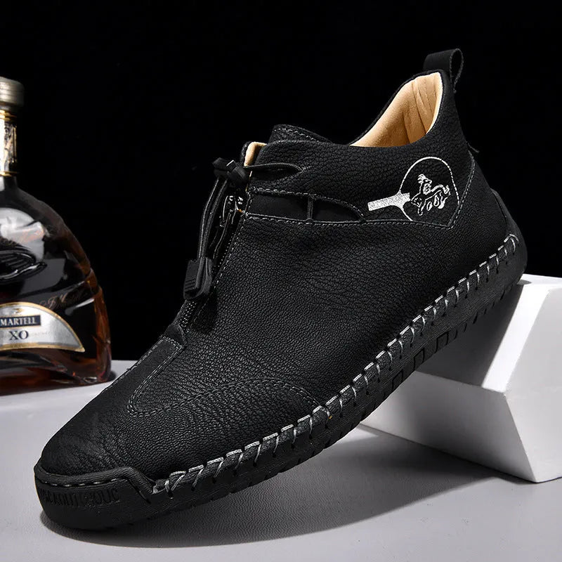 Men's black casual leather shoes with round toe, tall crown, and rubber sole.