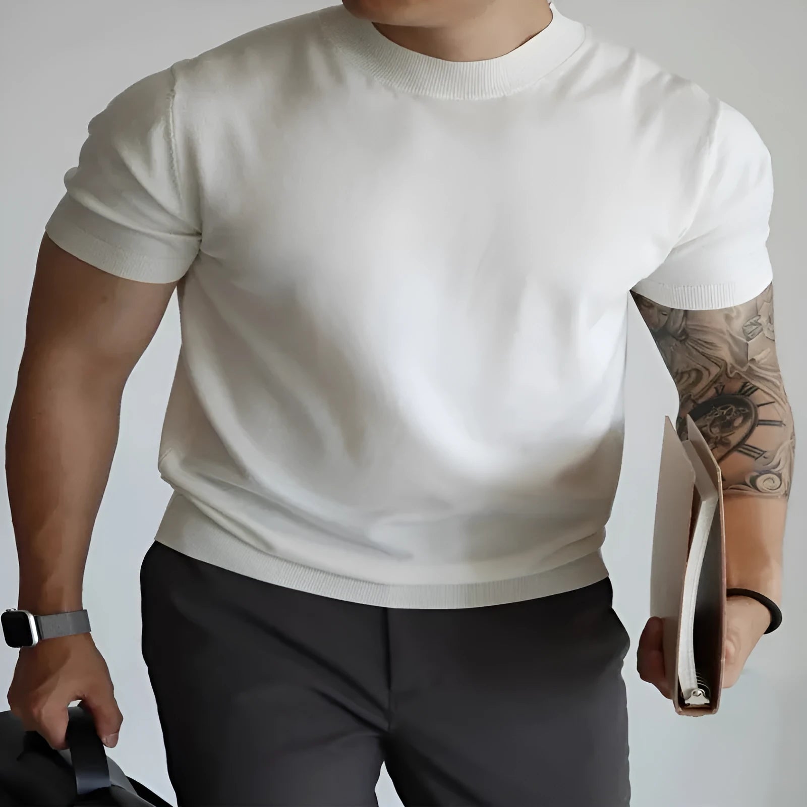 Men's slim-fit solid colour knit t-shirt in breathable polyester fabric on a hanger