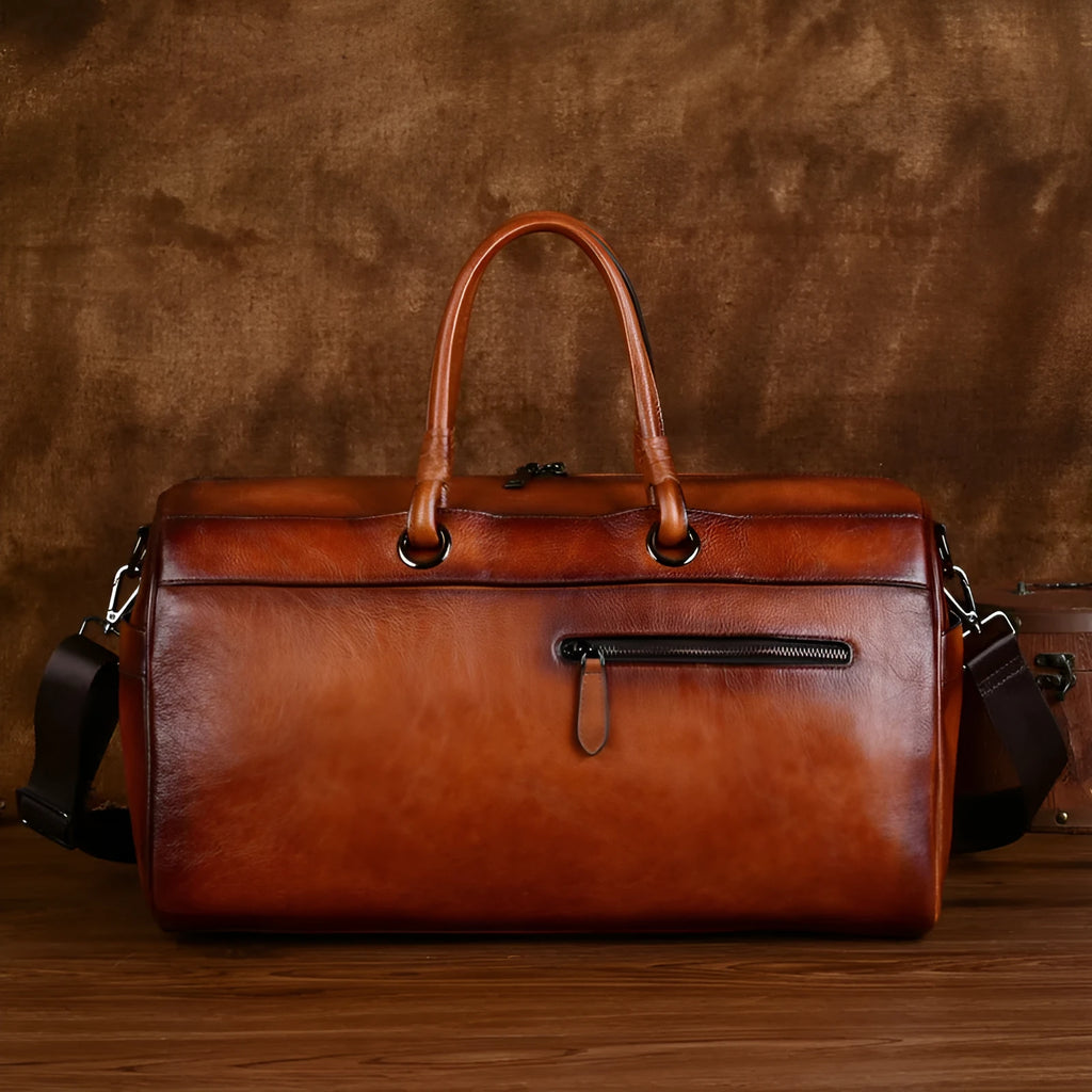 Handmade retro style leather bag in vintage brown colour showing first layer cowhide texture and large capacity design