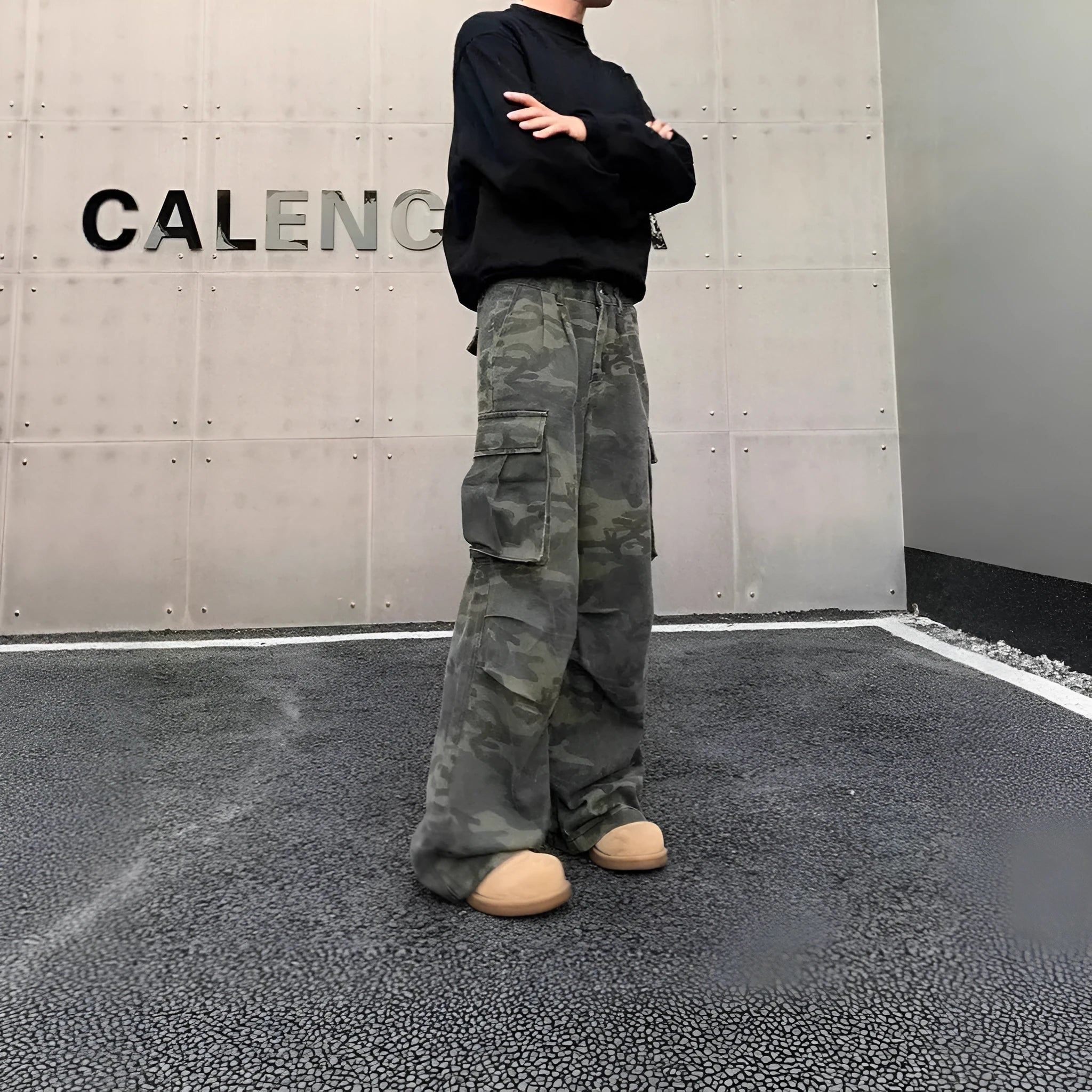 Cotton blend cargo pants in a washed camouflage print with multiple pockets and a mid waist.