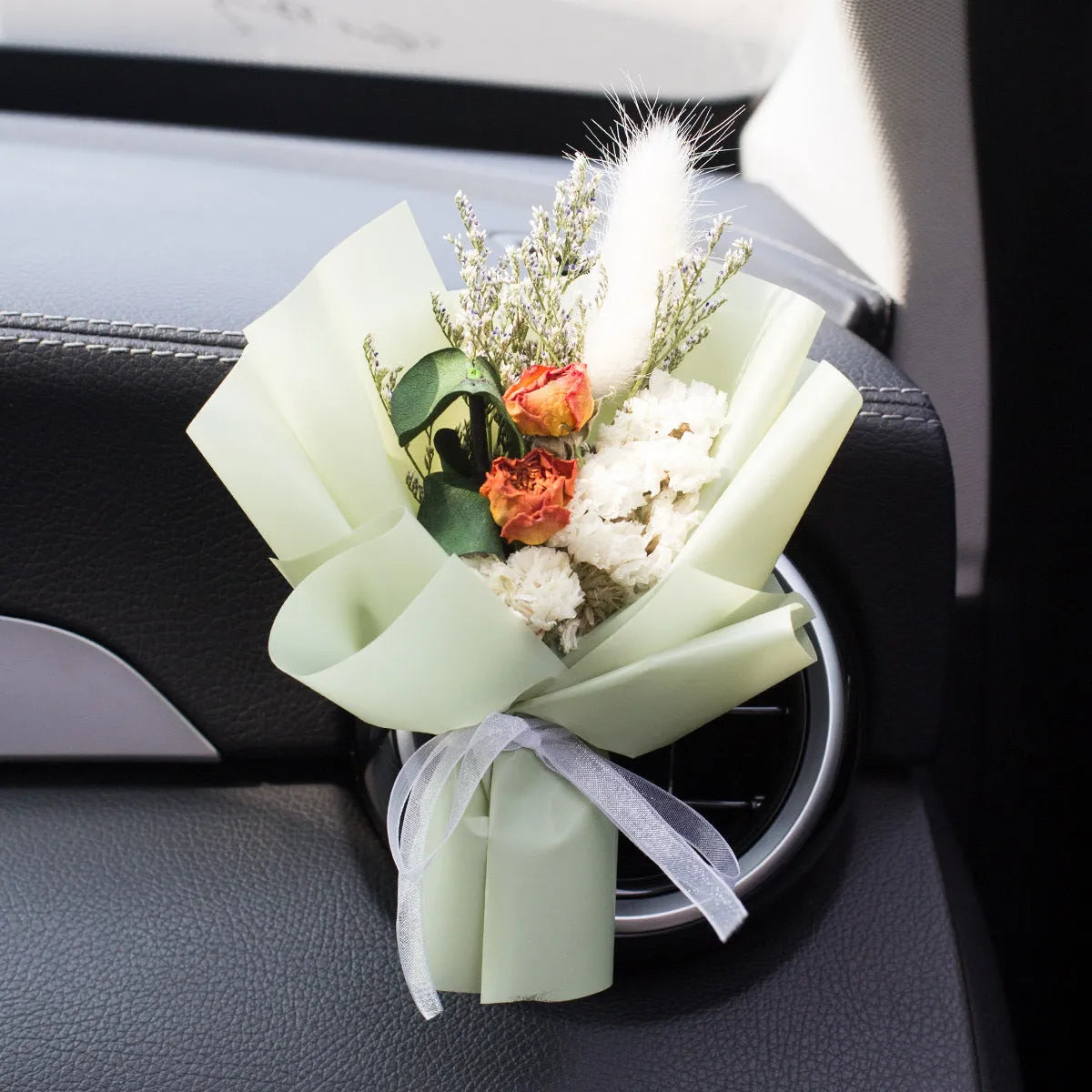 Handmade dried flower car air freshener ornament in multiple colours mounted on car vent