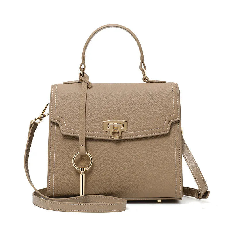 Elephant grey vintage handbag with litchi pattern texture and lock detail