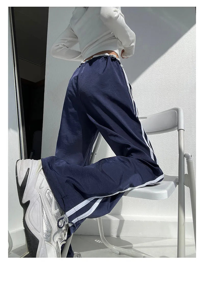 Women's loose straight-leg pants with ribbon parallel bar contrast detailing in navy blue colour option