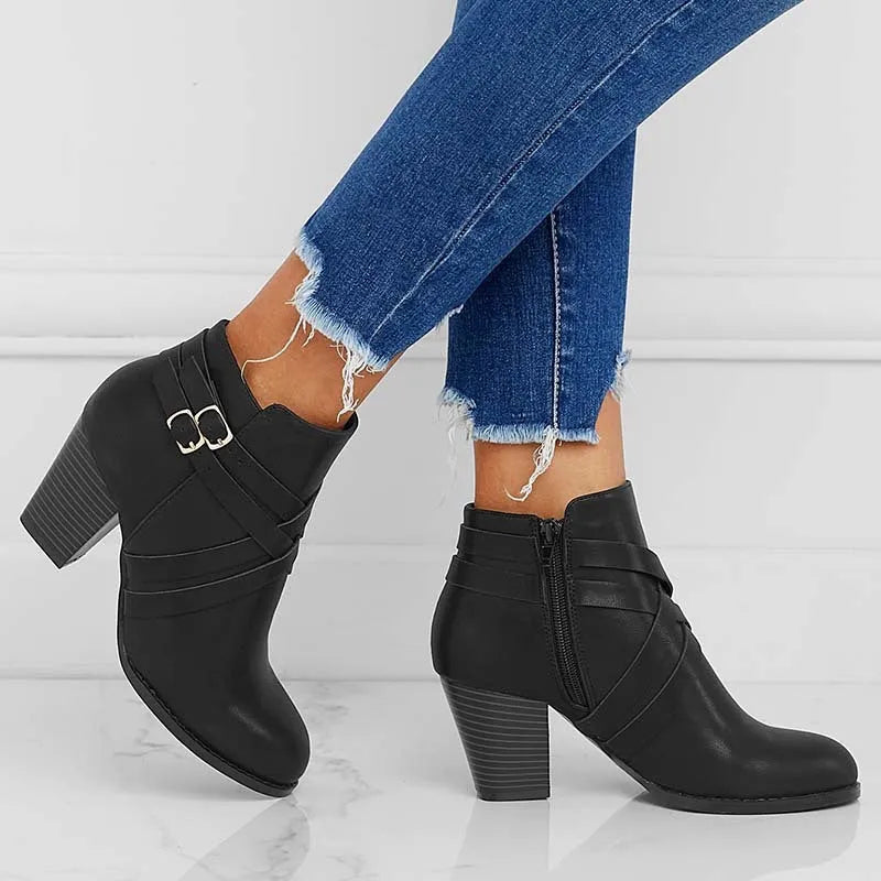 Women's grey PU leather short ankle boot with side zip, buckle strap, and a thick 7cm rubber heel.