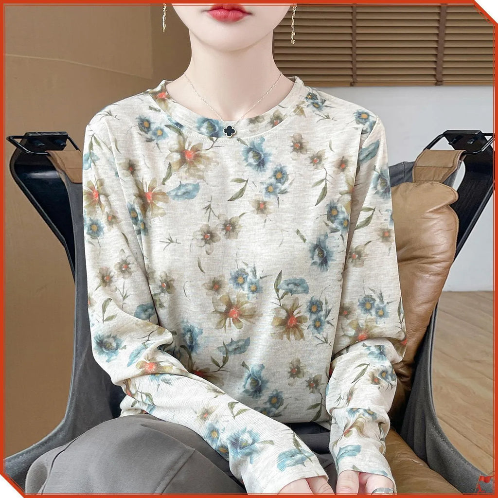 Women's round neck knit pullover shirt with artistic floral print in Tencel cotton fabric.