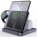 White three-in-one wireless charger with foldable bracket holding a folded smartphone