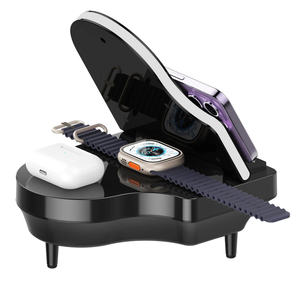 Black 3-in-1 Bluetooth speaker with wireless charger and phone holder on a desk