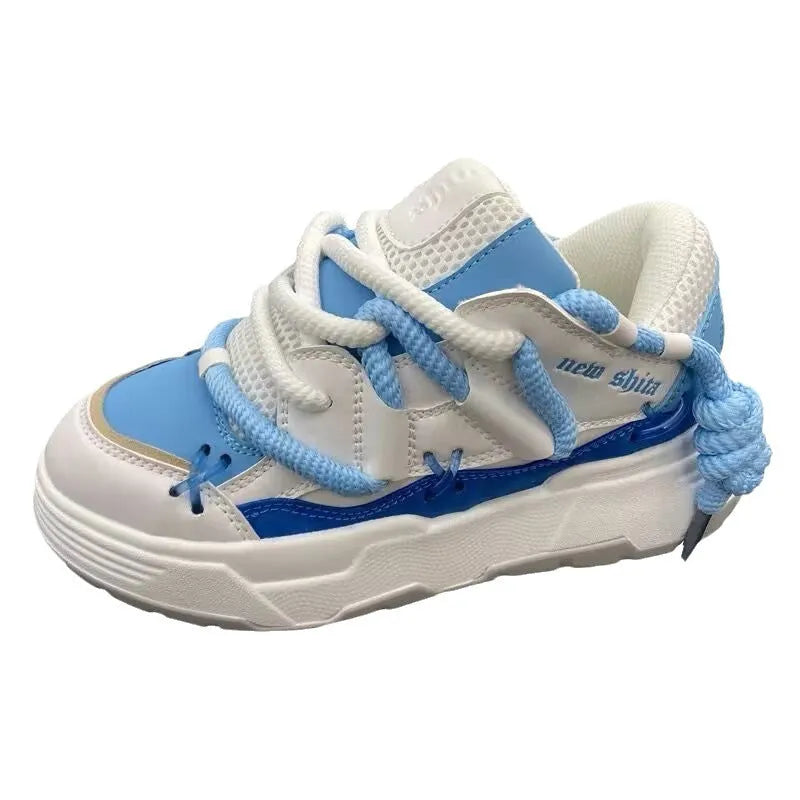 Women's grey retro chunky platform sneakers with thick rubber sole and lace-up design.