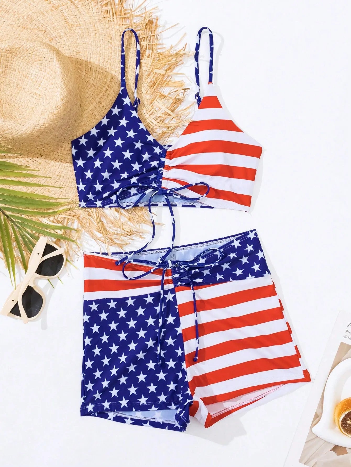 Women's high waist swimsuit briefs with boxer legs and a drawstring waist in a red, white, and blue Stars and Stripes pattern.