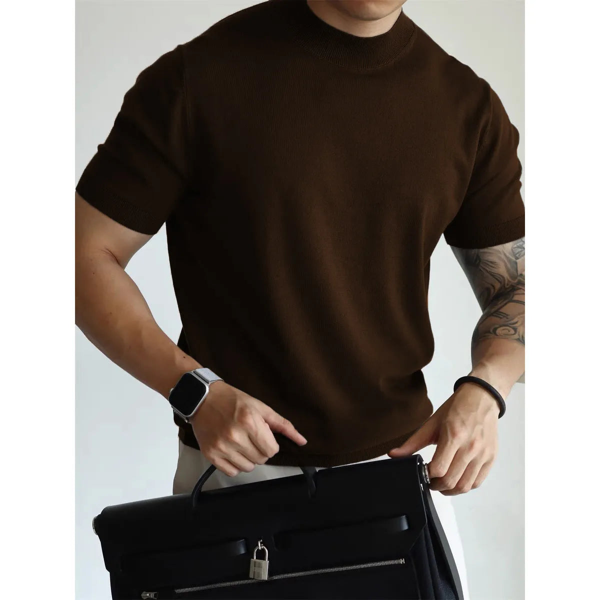 Men's slim-fit solid colour knit t-shirt in breathable polyester fabric on a hanger