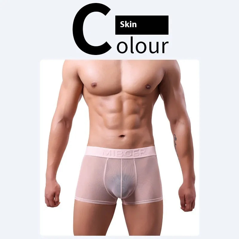 Men's thin solid colour boxer shorts in black, white, blue, green, pink, and skin colour on a white background.