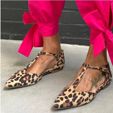 Leopard print women's pointed toe pumps with a chunky low heel and a cross ankle strap