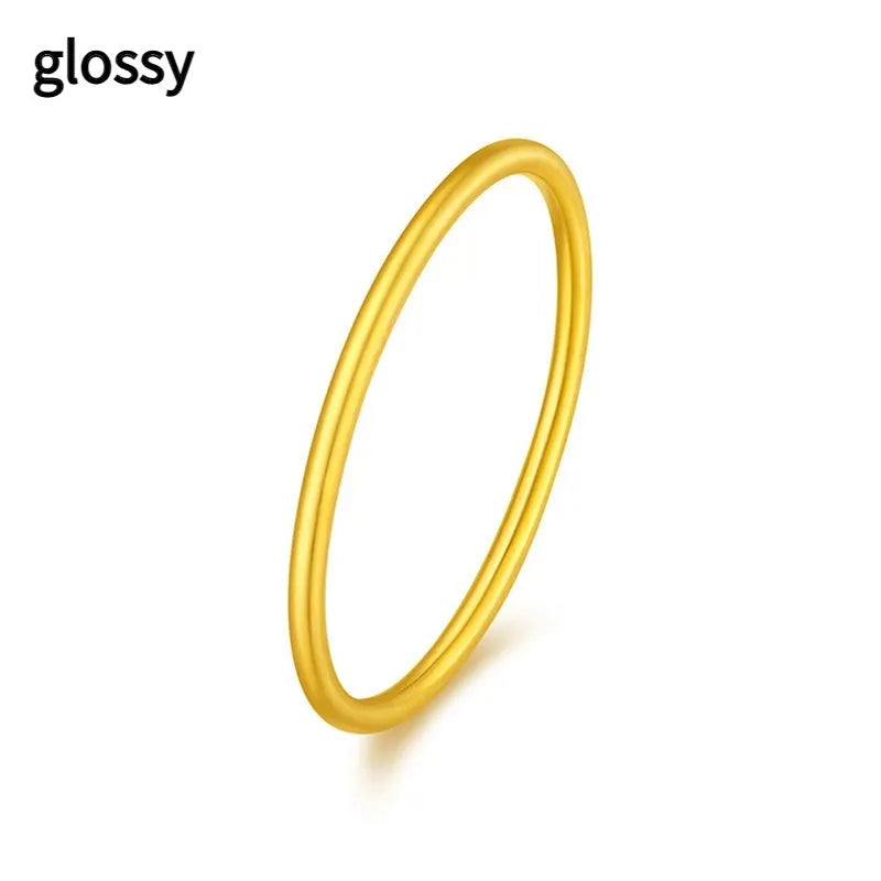 Brass gold plated women's ring showing twist, matte and glossy simple bracelet styles