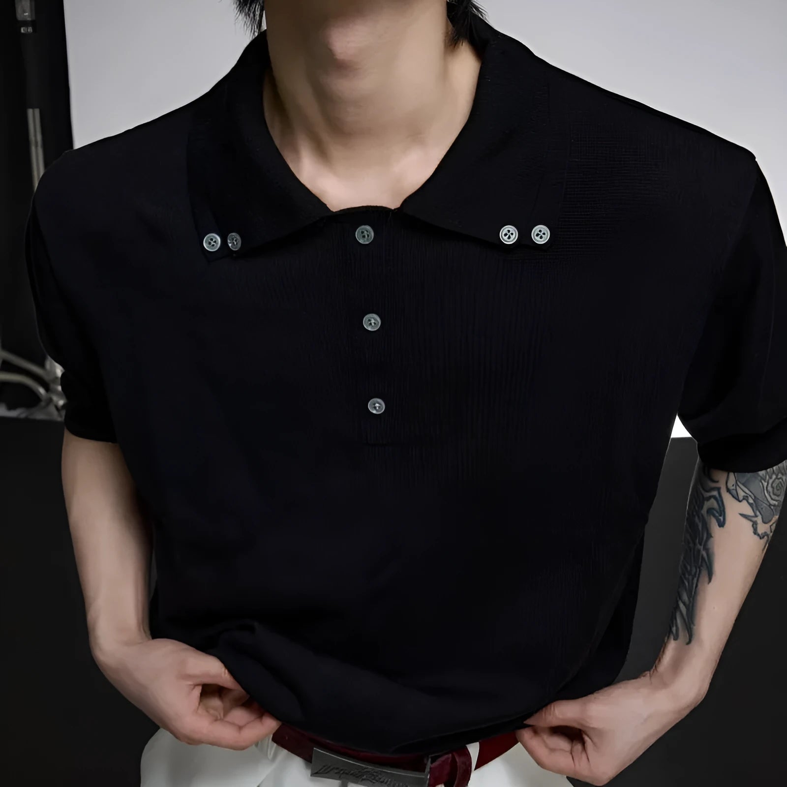 Men's black double collar polyester knit shirt with loose fit and short sleeves
