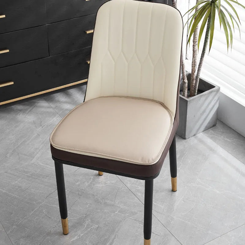 Leather horseshoe-shaped seat cushion in a solid colour showing its non-slip base and thickness.