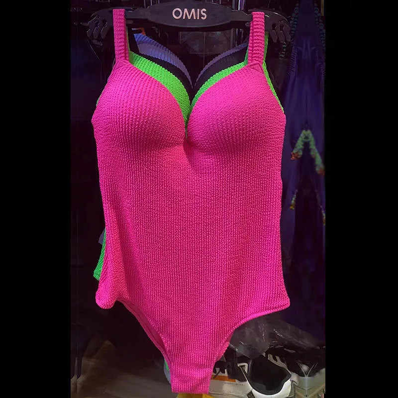 Women's sleeveless one-piece swimsuit in polyester for swimming, shown in solid colour options.