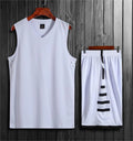 Black breathable sports vest and trousers set for basketball and fitness training on a neutral background.