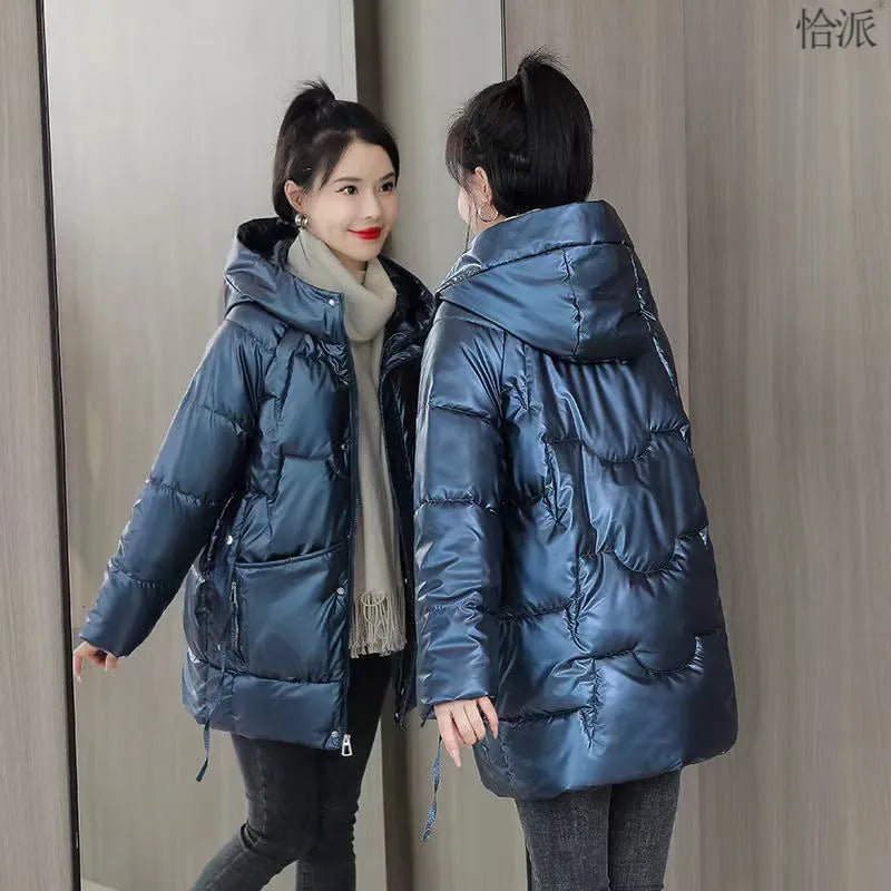 Women's loose thick hooded winter jacket in acrylic fabric on a hanger
