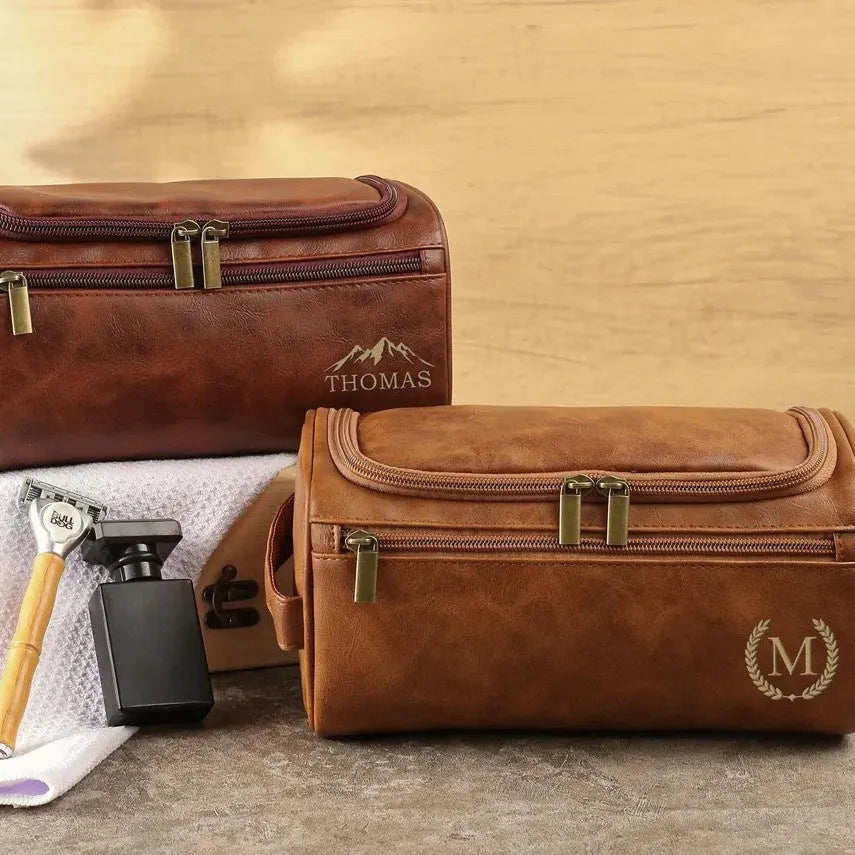Men's black PU leather travel toiletry bag with included makeup bag for bathroom storage