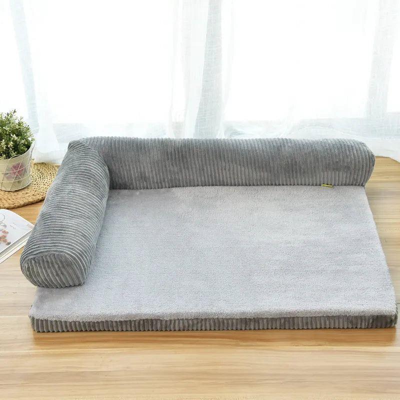 Corduroy pet dog bed sofa with removable cover in a grey colour, shown in a living room setting.