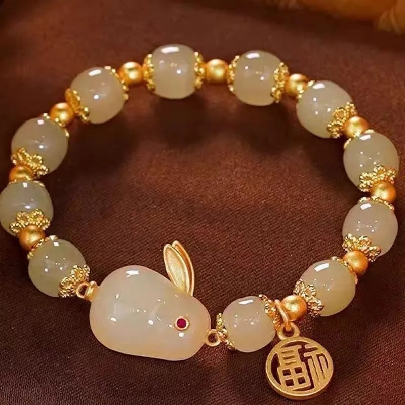 Green jade and black cord women's bracelet with fu character and hare pendant charms