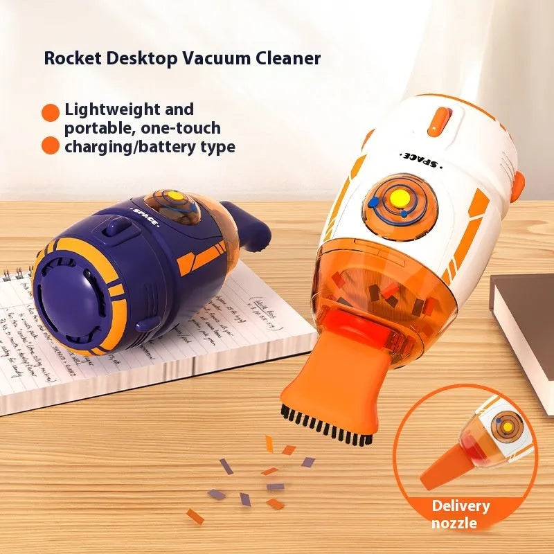 Blue handheld desktop USB vacuum cleaner on a wooden desk next to a keyboard