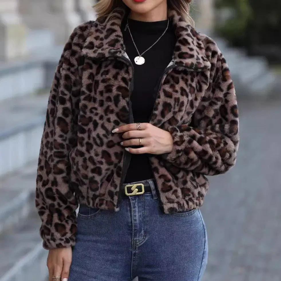 Women's loose-fitting leopard print plush coat with front zipper and raglan sleeves.