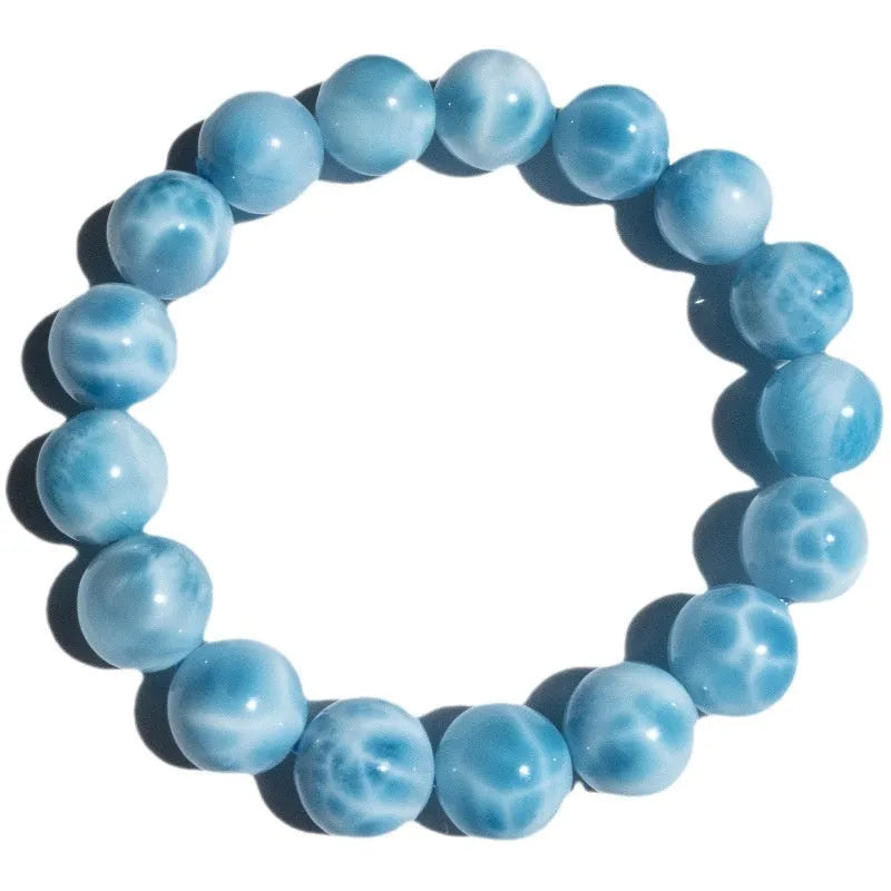 Blue Bodhi bracelet with pearl elements, showing Maillard style and range of bead sizes.