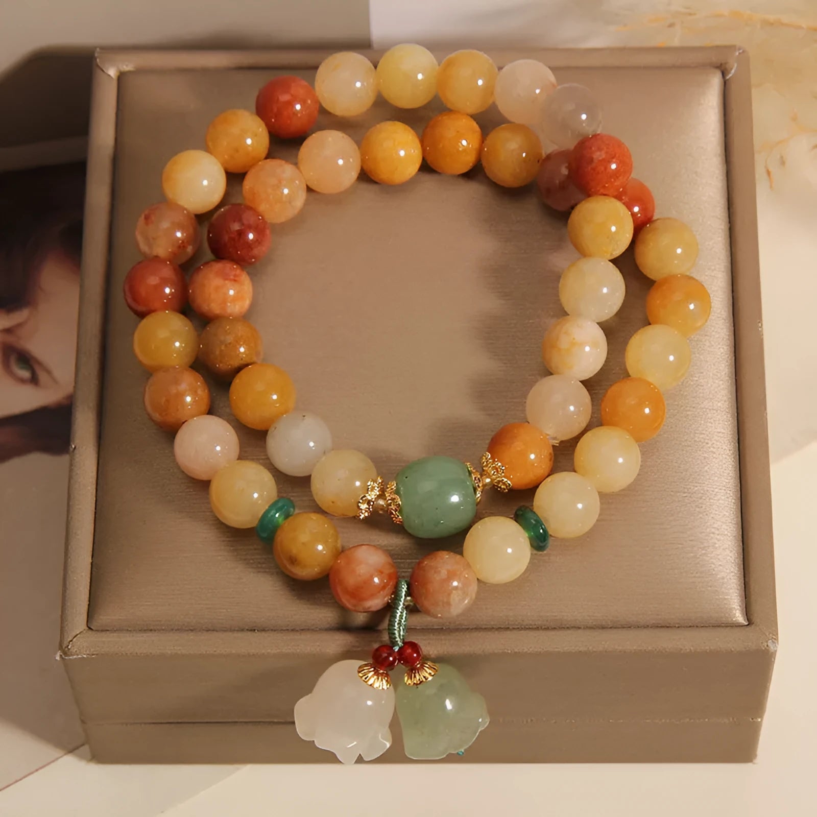 Women's natural jade multi-layer bracelet with orchid pendant on wrist