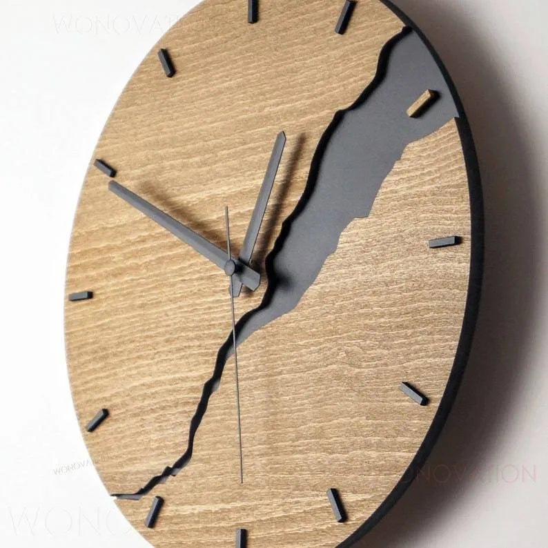 Modern wooden wall clock with a creative crack design on its face, shown in one of five available colour options.