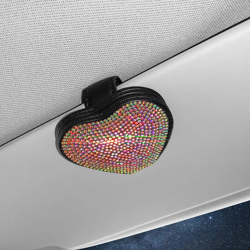 Black diamond-encrusted PU leather car sun visor clip holding sunglasses and a ticket.
