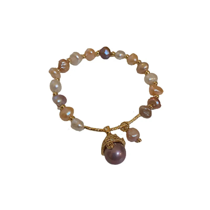 Baroque freshwater pearl zircon bracelet with geometric pearl inlaid design on a woman's wrist