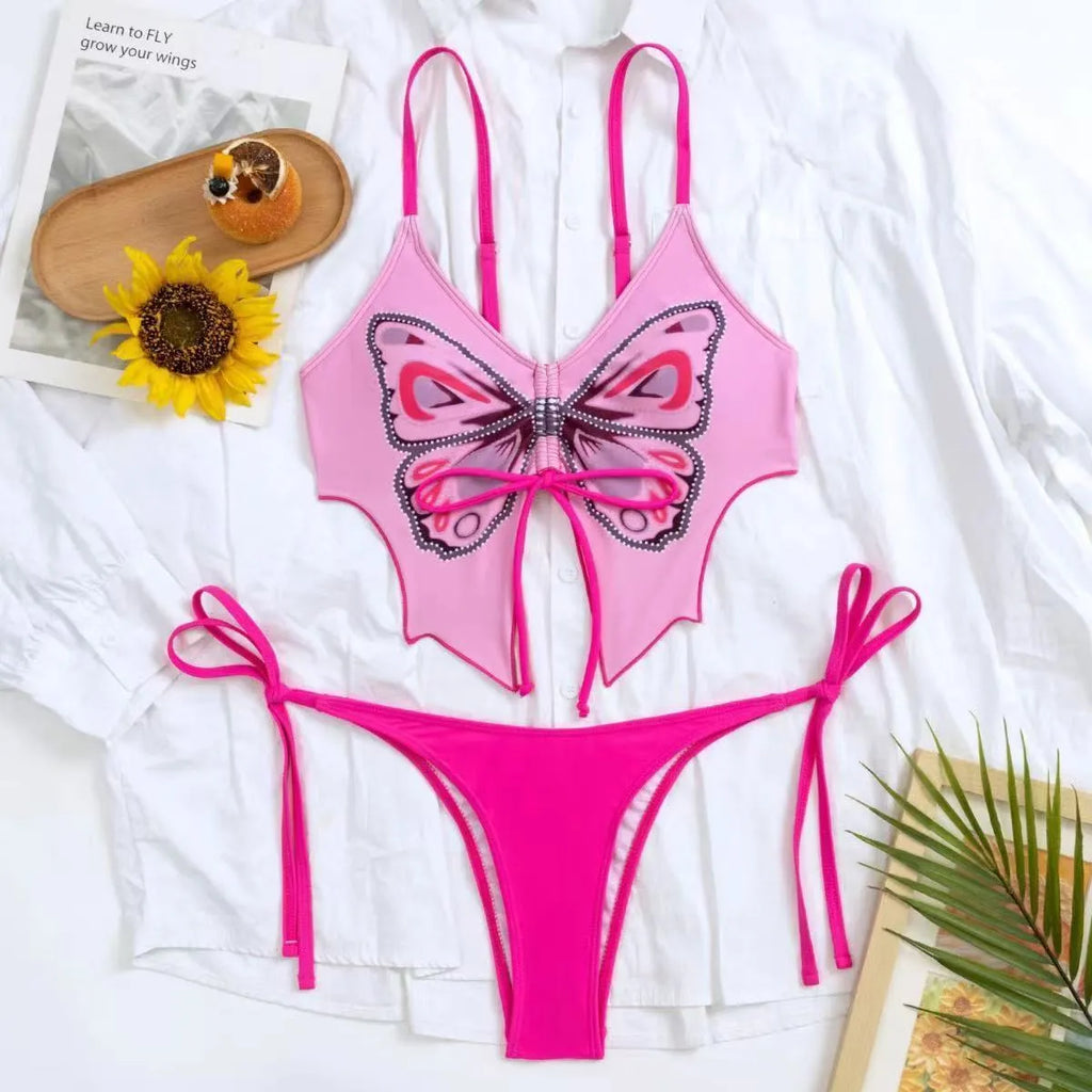 Women's purple bow ins style split bikini set with briefs, on a mannequin.