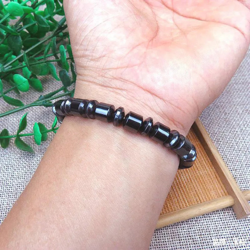 Black stretch bracelet with a pentagram stone, made from magnetite and hematite.
