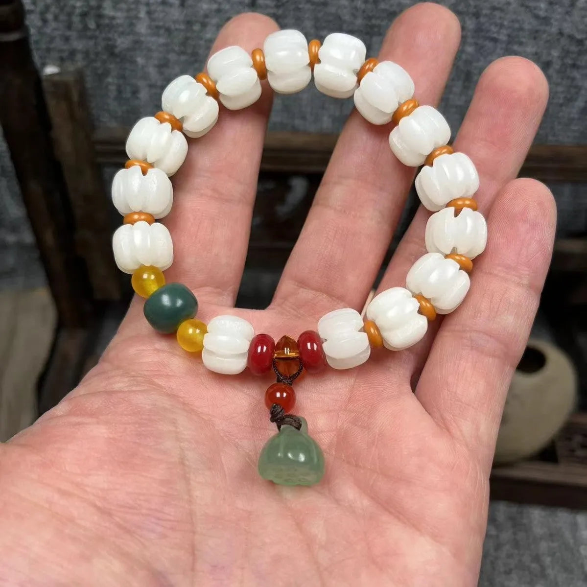 Carved bodhi root and white jade pumpkin lotus beads bracelet with cat's paw pendant.