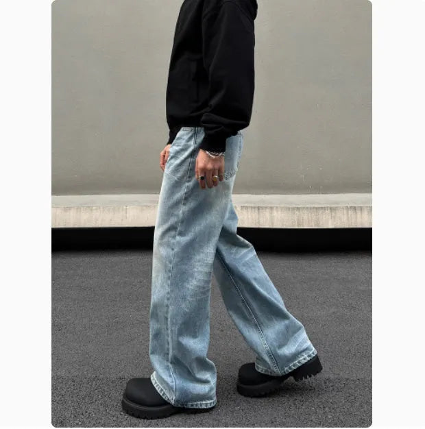 Men's blue straight jeans with whisker wash details and flared leg style