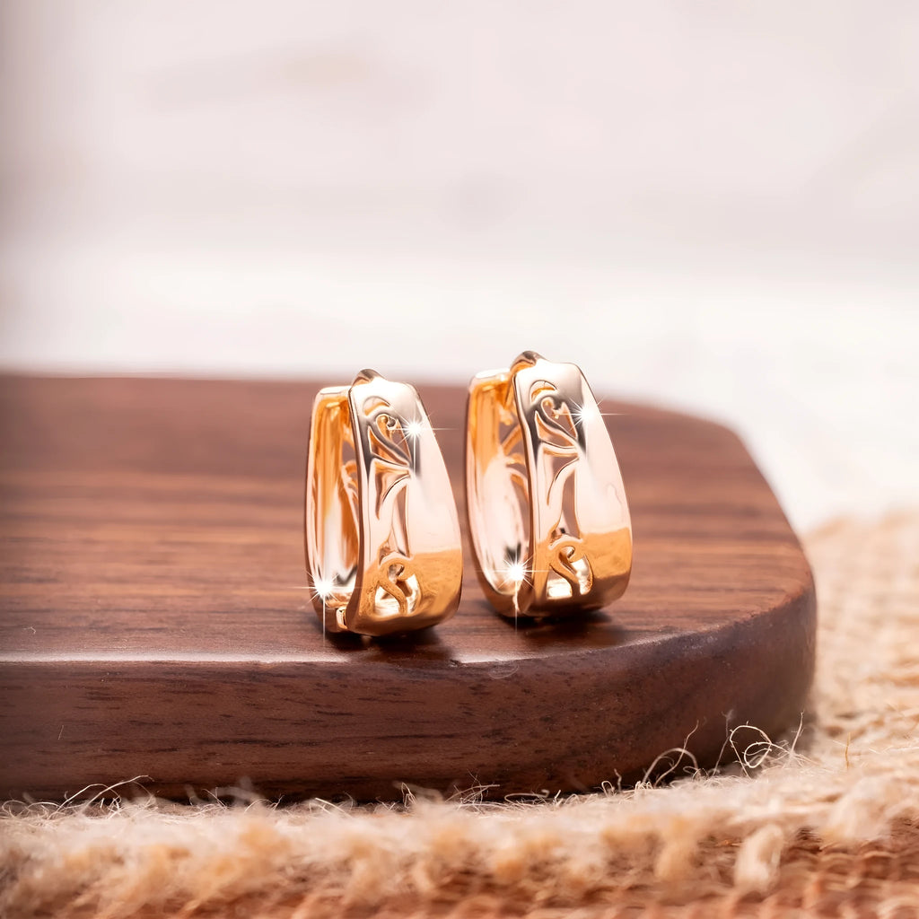 Rose gold U-shaped hollow carved women's earrings made from electroplated copper, one pair.