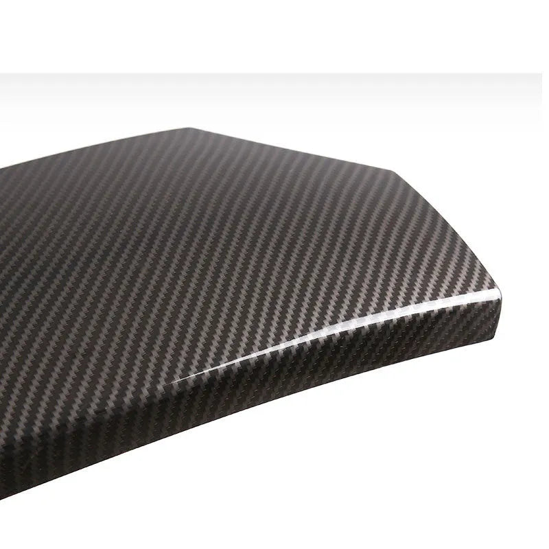 Black ABS carbon fibre pattern armrest protective cover set for car centre console, three pieces shown.