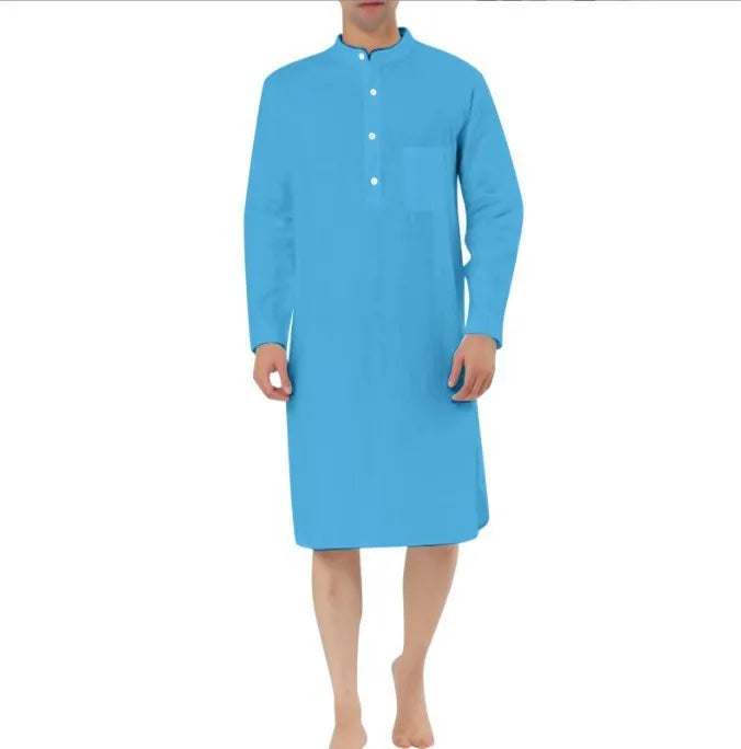 Man wearing a light blue cotton shirt robe with a simple chest pocket.