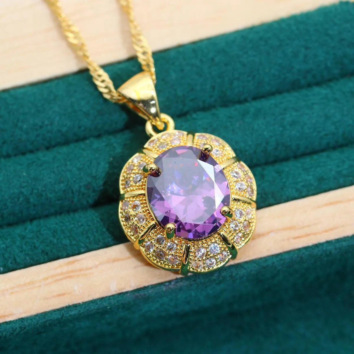 Complete 18k gold plated jewellery set showing necklace, earrings, ring and bracelet with multi-coloured cubic zirconia stones.