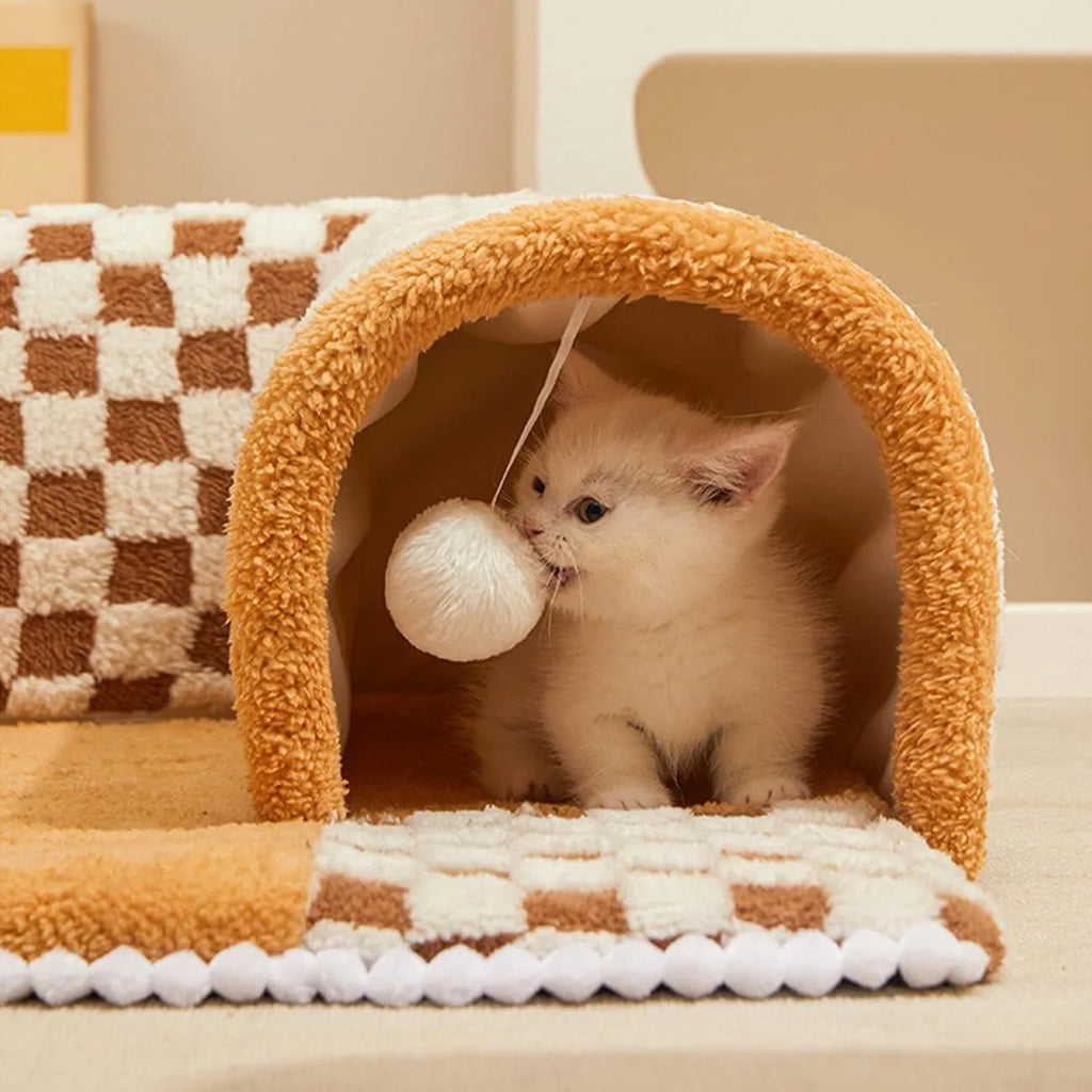 Fan-shaped plush pet bed with integrated tunnel in coffee colour, showing thick mat and anti-slip base.