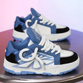 Men's white clunky sneakers with cartoon pattern, synthetic leather upper, rubber sole, and lace-up front.