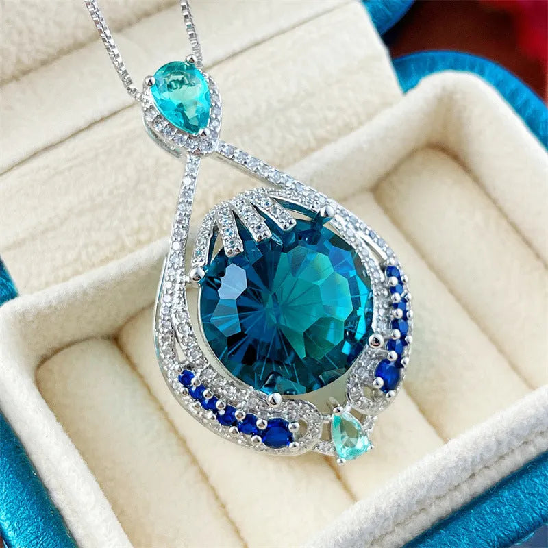 Blue geometric crystal necklace with fireworks-cut pendant on water wave chain