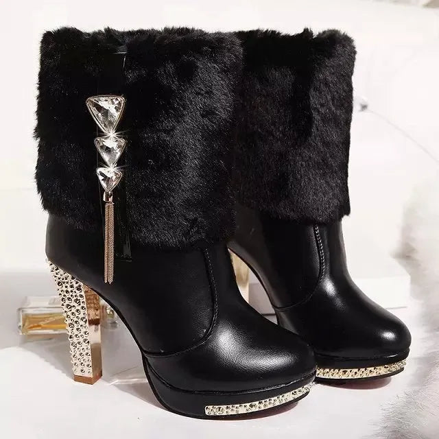 Women's black ankle boots with a chunky high heel on a white background