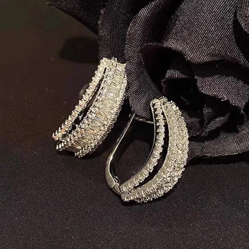 Geometric white gold colour zircon stud earrings with inlaid stone settings on copper